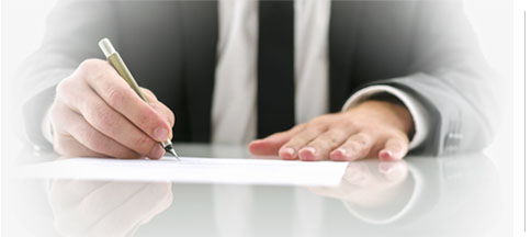 man writing on a piece of paper